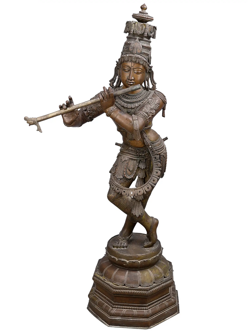 Bronze statue of Krishna playing a flute