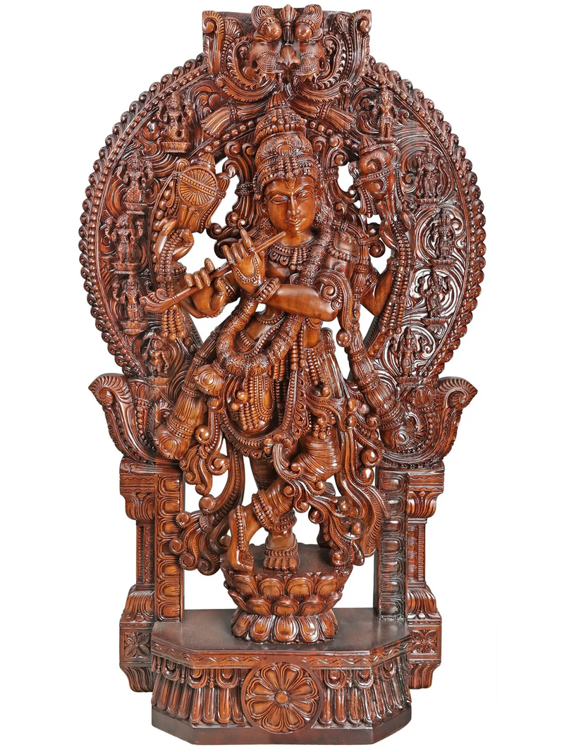 Carved wooden statue of krishna with intricate details