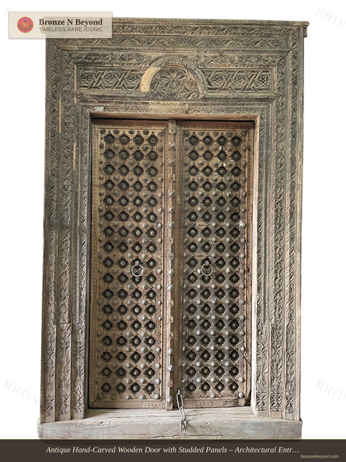 Antique Hand-Carved Wooden Door with Studded Panels