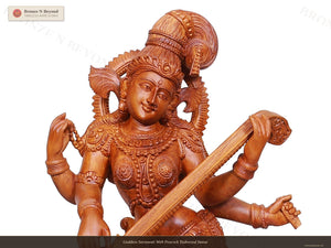 Goddess Saraswati With Peacock Teakwood Statue
