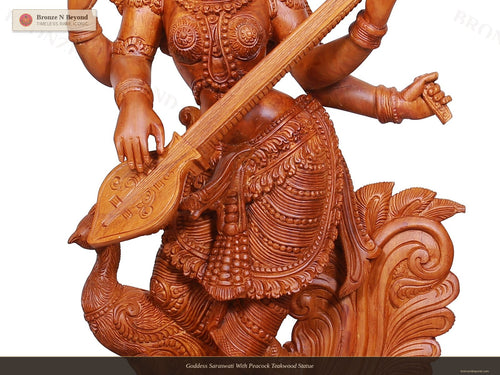 Goddess Saraswati With Peacock Teakwood Statue