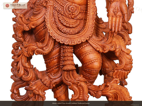 Handcrafted Four-Armed Lakshmi Teakwood Statue