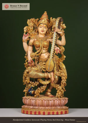 Handpainted Goddess Saraswati Playing Veena And Dancing- Wood Statue