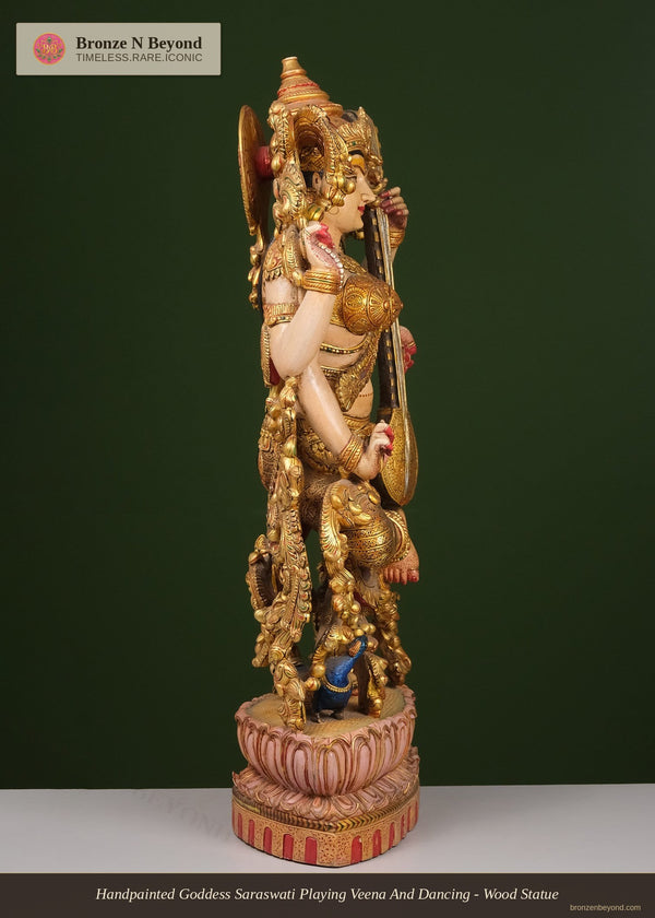 Handpainted Goddess Saraswati Playing Veena And Dancing - Wood Statue