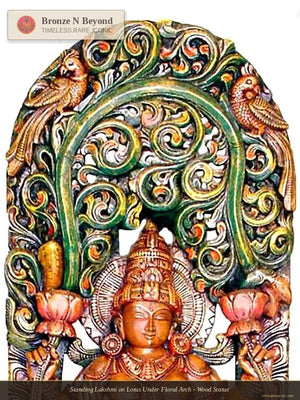 Decorative wall art with a central figure and intricate arch design.