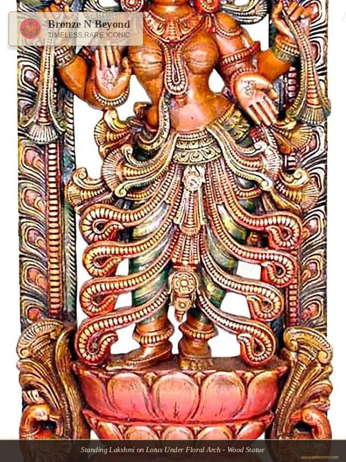 Standing Lakshmi on Lotus Under Floral Arch - Wood Statue