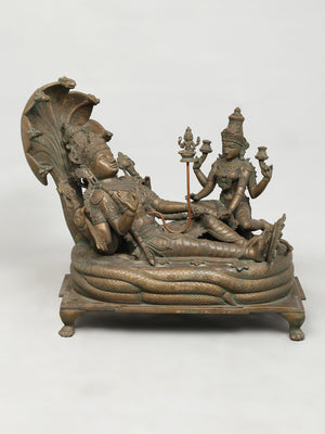 Reclining Vishnu on Serpent Couch with Lakshmi in Bronze